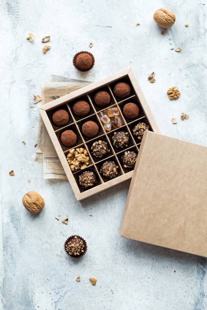 istock Chocolate truffle balls with cocoa powder in box 1287589402