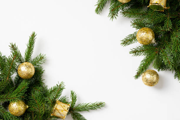 istock Christmas banner with a Christmas tree and gold decorations on a light background. Christmas or new year flatly. Copyspace 1287590414