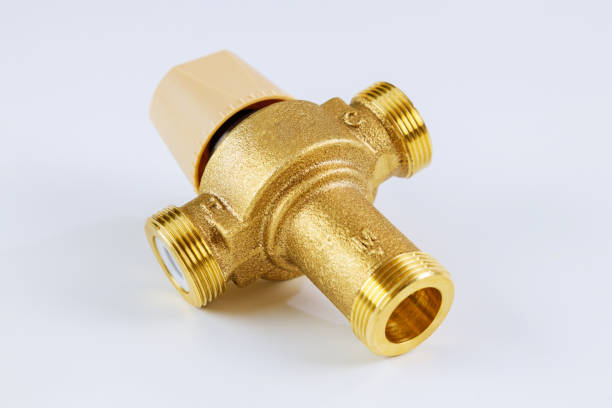 istock Water various supply plumbing brass thermostatic mixing valve isolated on white background. 1287596541