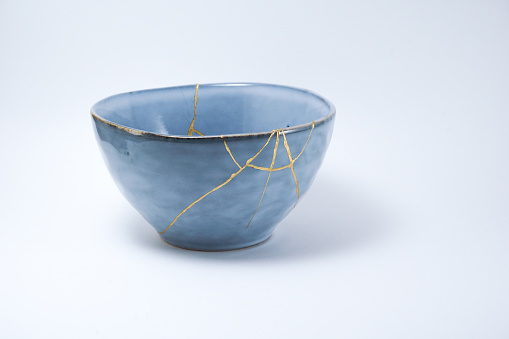 Kintsugi blue bowl repaired with gold.