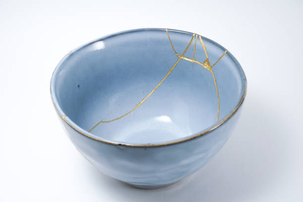 istock Kintsugi blue bowl repaired with gold. 1287597055