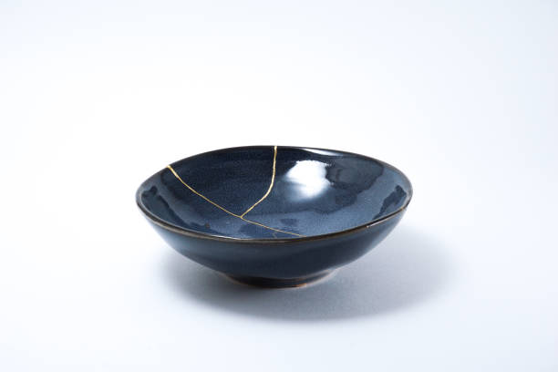 istock Kintsugi blue bowl repaired with gold. 1287597106