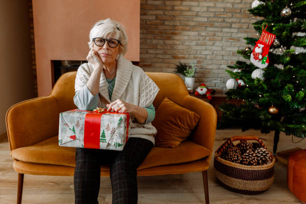 istock Elderly woman sad and alone at Christmas. 1287597298