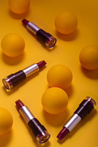 istock Still life Lipstick on yellow background seen from above. 1287598068