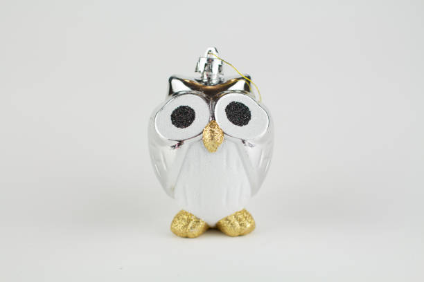 istock Christmas tree toy owl on a white background 1287598153