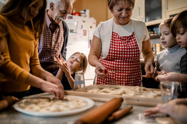 istock Kids with Grandparents at home 1287598197