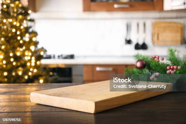 https://media.istockphoto.com/id/1287598755/photo/empty-cutting-board-on-wooden-tabletop-with-and-blurred-holiday-kitchen-decorated-christmas.jpg?s=612x612&w=is&k=20&c=LFW7FsZtJOEcvHU2d2FHFm1PVeYnz9lgd8Wwobux5-s=