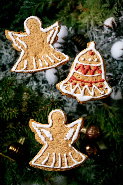 istock Christmas gingerbread cookies with icing ornate. Xmas decorations, dark background. Top view 1287599646