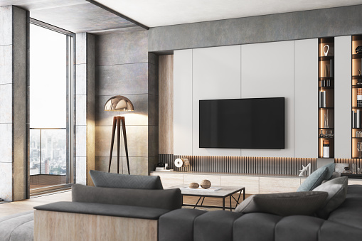 Interior of a luxurious living room with television set.