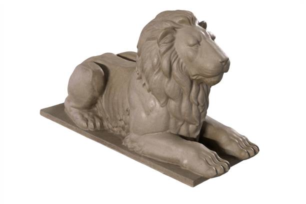 istock 3D render of lying lion stone sculpture isolated on white 1287605083