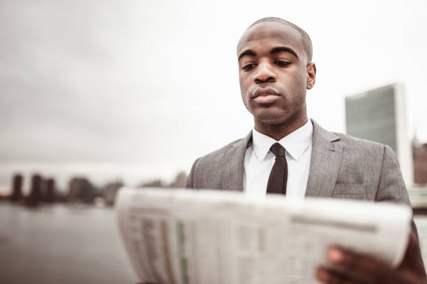 istock businessman with the newspaper on nyc 1287610471