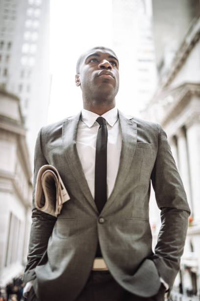 istock businessman with the newspaper on nyc 1287610527