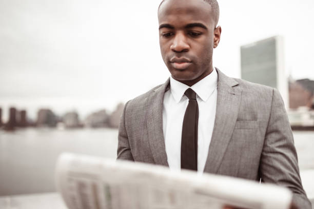istock businessman with the newspaper on nyc 1287610682