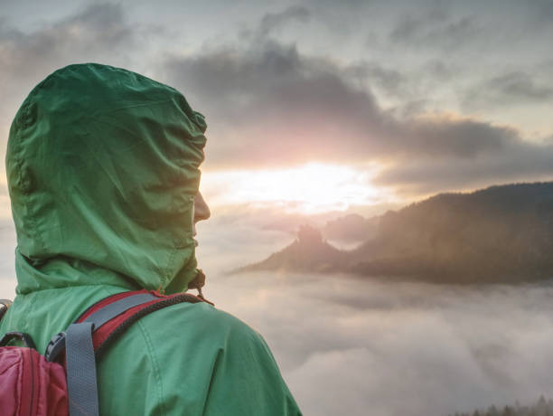 istock Girlfriend Wear  Waterproof Jacket Or Windcheater With Hood And Red Running Backpack. Short Break 1287610765