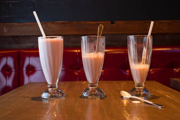 istock Milkshakes. Milkshakes or Fruit smoothies. Classic America favorite: chocolate, vanilla or strawberry ice cream, milk, fruits and ice blended and served in milk shake glasses. Traditional diner drink. 1287612061
