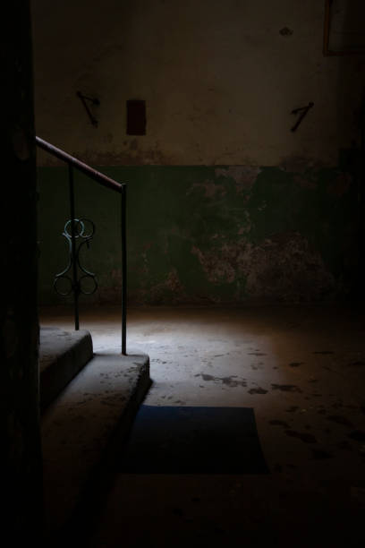 istock Destroyed staircase with a metal railing nostalgically illuminated 1287614624