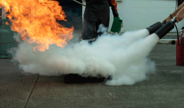 istock Man teaches or training how to use carbon dioxide  (CO2) fire extinguishers to extinguish fires from fuel. 1287615447