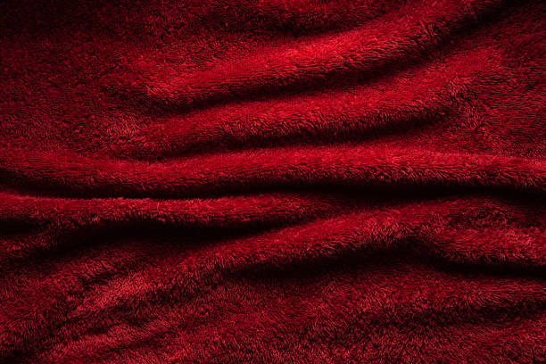 istock A soft red terry towel. Burgundy texture background. Underlay and free space for text. 1287615533