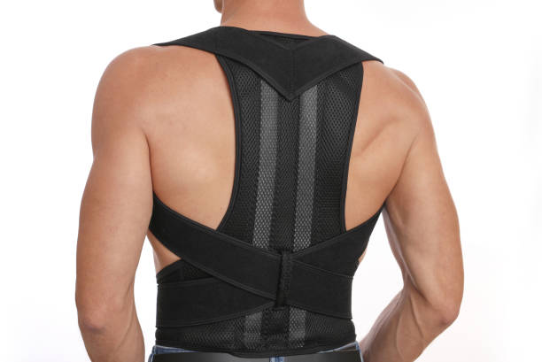 istock Posture correction. Scoliosis, Kyphosis treatment. Manw earing posture posture corrector belt 1287616913