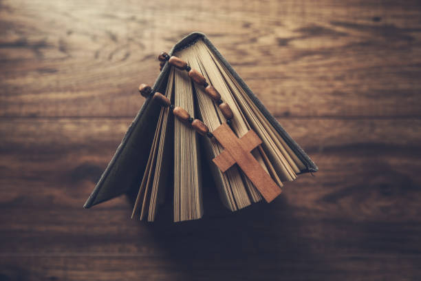 istock wooden cross on the Bible 1287619671