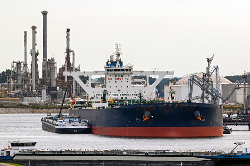 Oil tankers moored near a petrochemical plant in the Port of Rotterdam. Rotterdam.