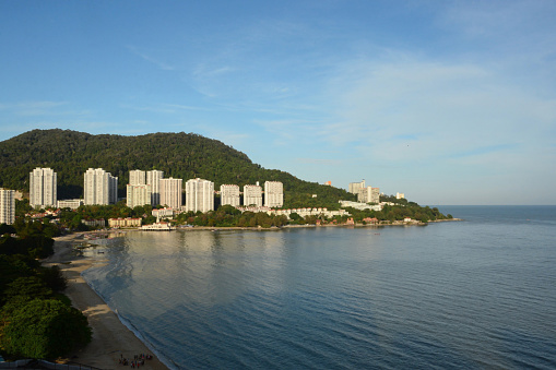 Coastline of Penang island view towards apartments and the strait of Malacca.