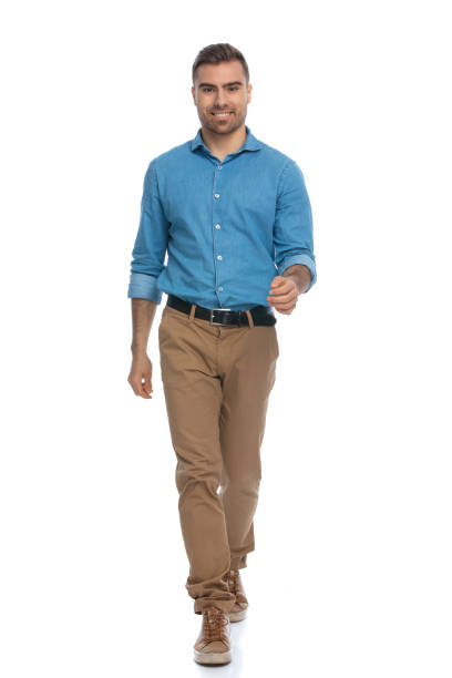 istock casual man walking just walking towards the camera 1287622597