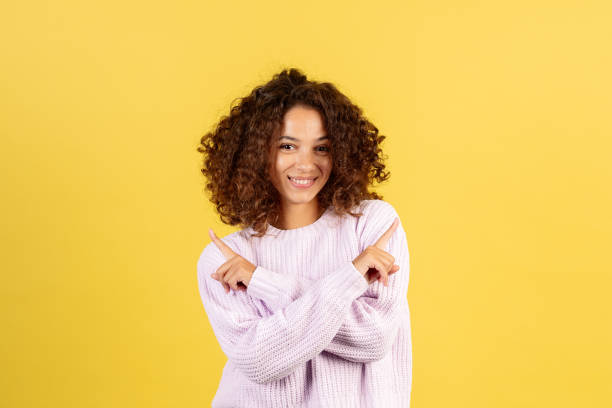 istock Young afro american woman on yellow copy space background 1287623478