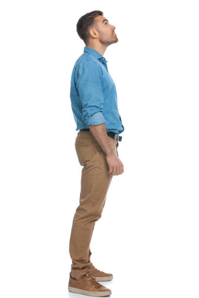 istock attractive casual man waiting in line and looking up 1287623500