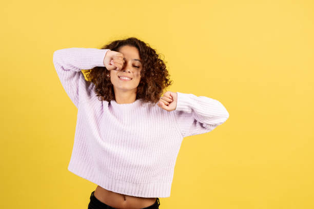 istock Young african american woman on yellow copy space background 1287623507