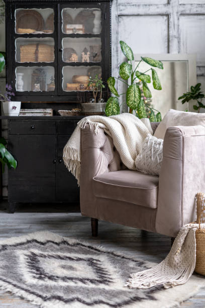 Comfortable armchair with cushion in living room