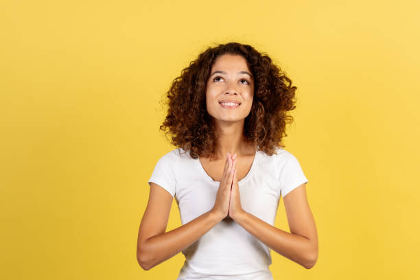 istock Young african american woman on yellow copy space background 1287623574