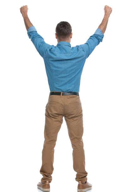 istock excited casual man celebrating succes with his arms up 1287623583