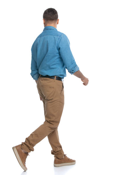 istock casual man walking one way and looking the other 1287623640