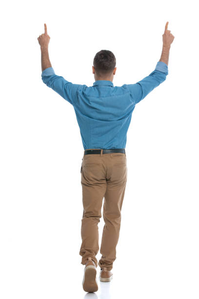 istock casual man walking away from the camera 1287623675