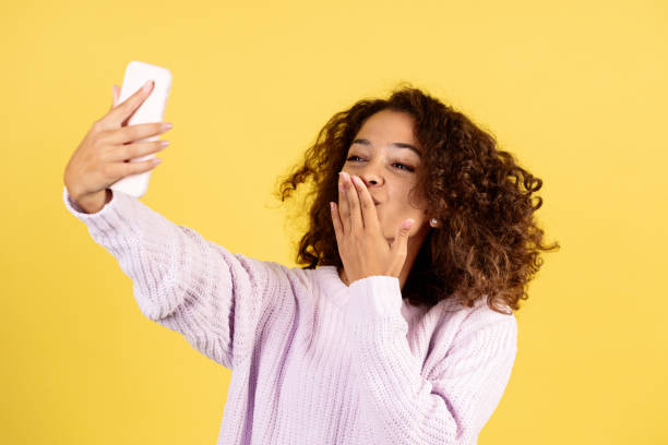 istock Young afro american woman on yellow copy space background 1287623677