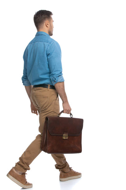 istock young casual guy walking on his way 1287624101