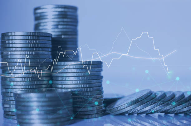 istock double exposure of city with row of coin stack with growth stock chart and graph progress report for business investment finance banking and money saving concept. 1287625691