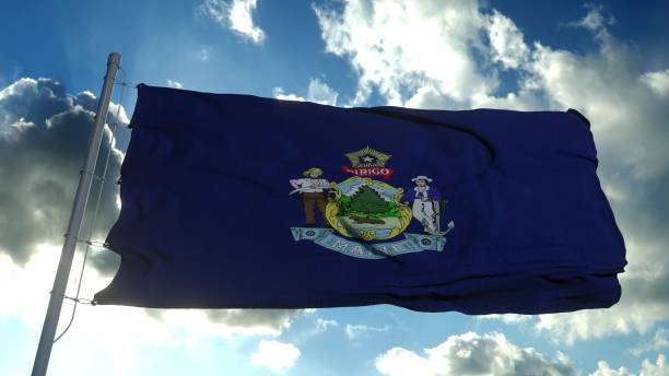 istock Maine flag on a flagpole waving in the wind, blue sky background. 3d rendering 1287627944