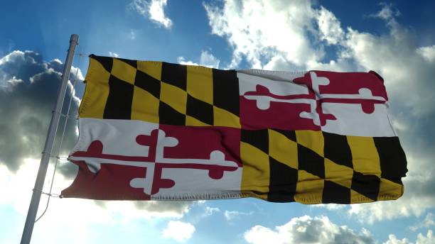 istock Maryland flag on a flagpole waving in the wind, blue sky background. 3d rendering 1287628717