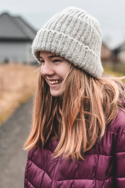 istock Laughing girl with woolen cap 1287628790