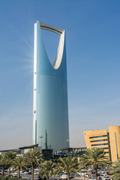 Kingdom Center tower or Burj Al Mamlaka glows a blue color  again blue sky stock photo
