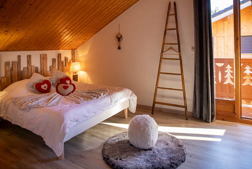 A bedroom in a ski chalet rental in Sameon, France.