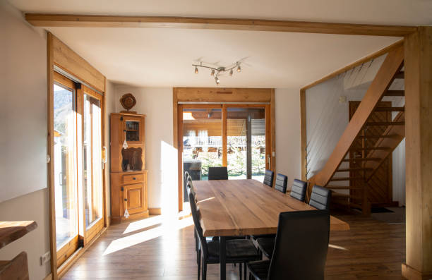 Ready for Dinner A dining room in a ski chalet rental in Sameon, France. rustic door stock pictures, royalty-free photos & images
