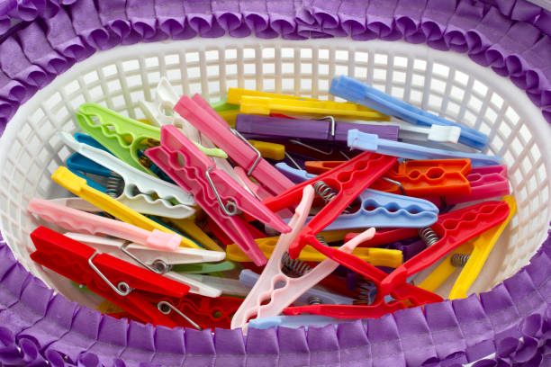 istock Multi colored clothes pegs in the basket 1287631513