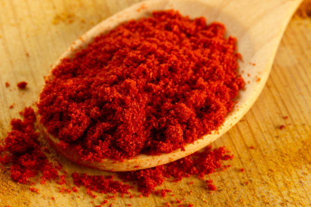 istock Paprika powder in wooden spoon 1287631553