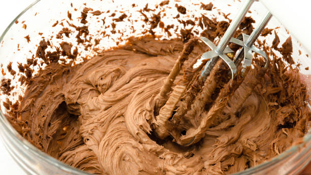 istock Melted chocolate buttercream close up in a glass bowl 1287632317