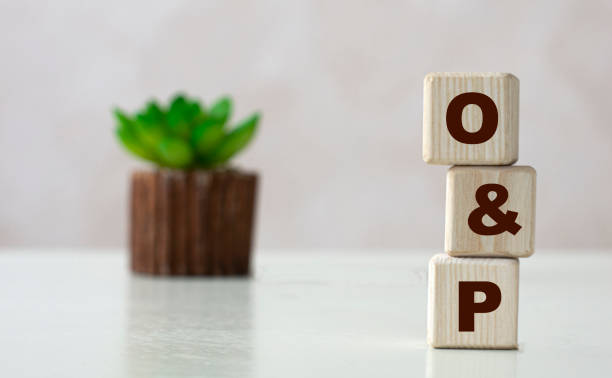 istock O&P word on wooden cubes on a light background with a cactus 1287633708