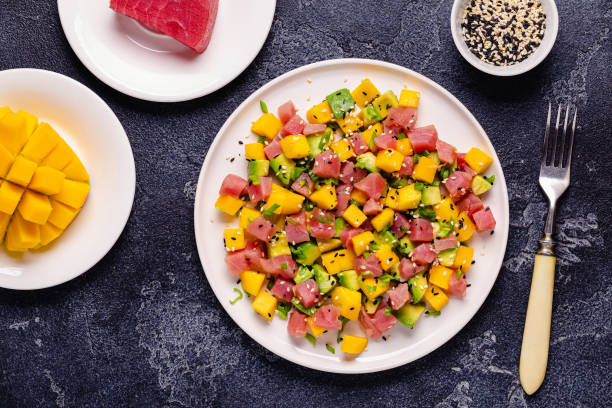 Tuna mango avocado salad tartare served with green onions and sesame seeds
