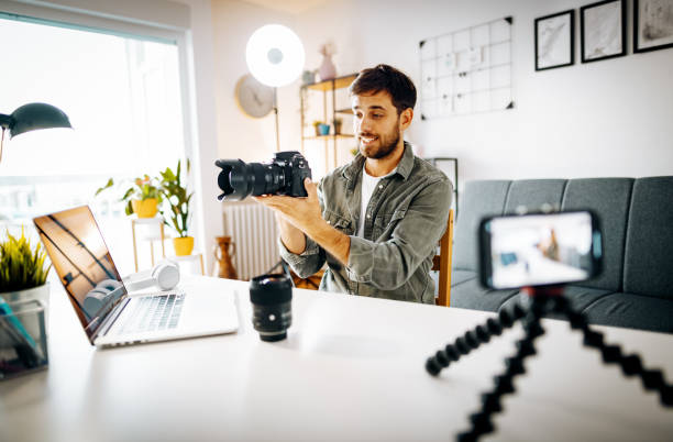 istock Photographer - influencer vlogging from home with newest camera 1287635293